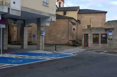 an empty parking lot in front of a building at Ribadeo Cantábrico Yporá Deptos in Ribadeo