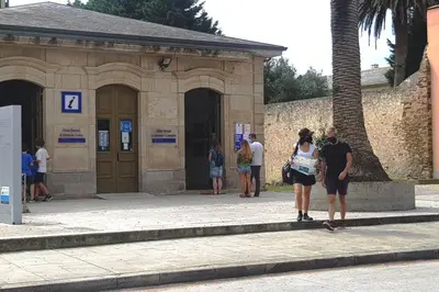 a group of people standing outside of a building at Ribadeo Cantábrico Yporá Deptos in Ribadeo