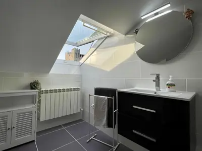 a bathroom with a sink and a mirror at Alojamientos con encanto Ruliña in Portomarin