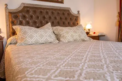 a bedroom with a bed with two pillows at Casa De Cacheiro in Silleda