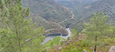 a view of a river in a valley with a bridge at Alojamiento Pena da Osa in Sober