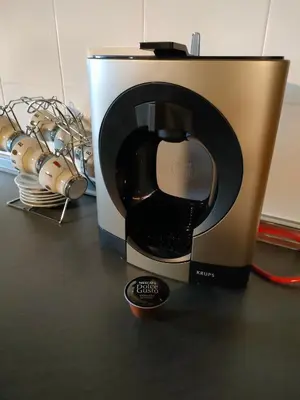 a coffee maker sitting on top of a table at As Veneiras Casa in Neipín