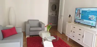 a living room with a couch and a tv at CONTRASTES RIBEIRA SACRA in Monforte de Lemos