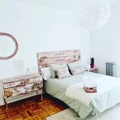 a bedroom with a large bed and a mirror at CONTRASTES RIBEIRA SACRA in Monforte de Lemos