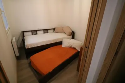 a small room with two bunk beds in it at Buen Camino Melide in Melide