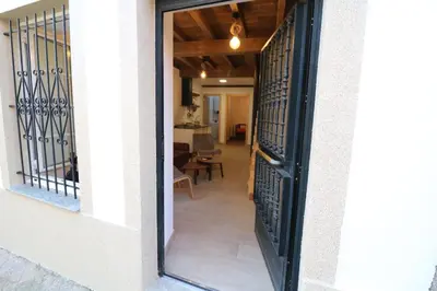 an open door to a hallway with a living room at Buen Camino Melide in Melide
