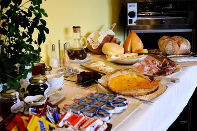 a table with a buffet of food on it at Casa Peleyón in Castropol
