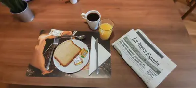 a plate of food with a sandwich and a cup of coffee at HOLIDAY HOMES by del abuelo VEGADEO in Vegadeo