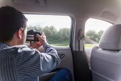 a man taking a picture while sitting in a car looking out the window at HOLIDAY HOMES by del abuelo VEGADEO in Vegadeo
