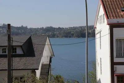 a view of a lake from between two buildings at Luky Miño in Miño