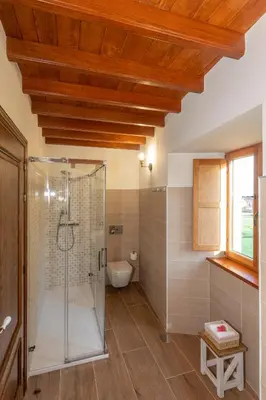a bathroom with a shower and a toilet at Araucaria House in Barreiros