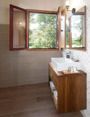 a bathroom with a sink and a window at Araucaria House in Barreiros