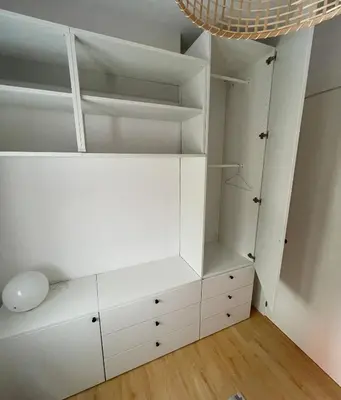 a white closet with white shelves and a ceiling at Home Las Burgas D&C in Ourense