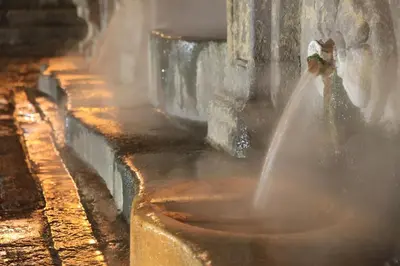 a person is spewing water into a bucket at Home Las Burgas D&C in Ourense