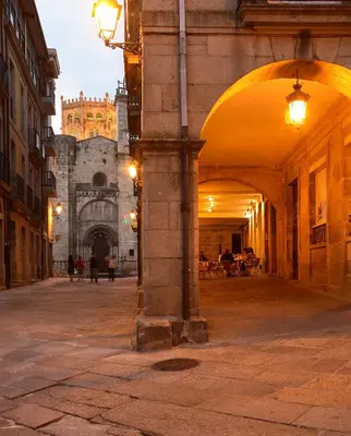 an alley in a city with a building in the background at Home Las Burgas D&C in Ourense