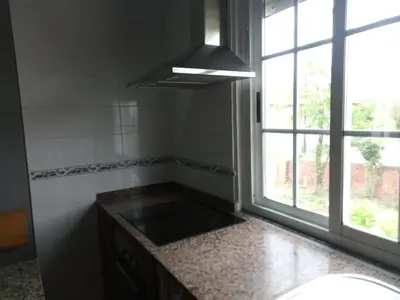 a kitchen with a sink and a window at CAMBOTE Vivienda turìstica in Lugo