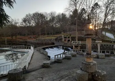a skate park with a pond and a bridge at CAMBOTE Vivienda turìstica in Lugo