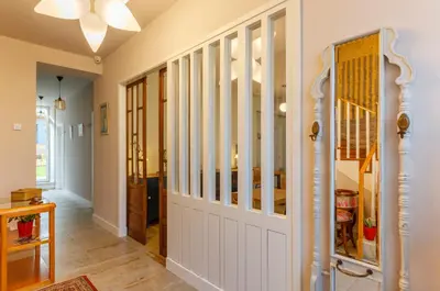 a hallway with a white door in a house at Hotel Casa da Galbana in Friol