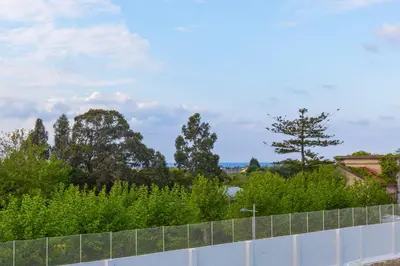 a view from the roof of a house with trees at APARTAMENTO RIAMAR - A ESTRENAR in Ribadeo