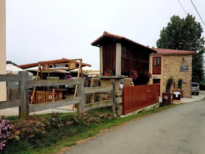 a wooden fence in front of a house at Albergue El Aleman in Boente