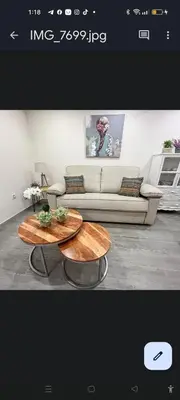 a living room with a couch and a coffee table at APARTAMENTOS TURISTICOS LAS CANDELAS in Puebla de Sanabria