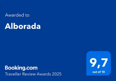 a blue screen with the text awarded to albania travelling review awards at Alborada in Viveiro