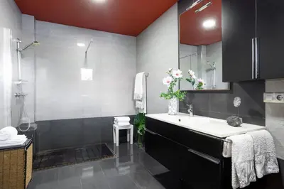 a bathroom with a sink and a shower at LE LLAR casa con 2 PISCINAS 1 CLIMATIZADA INTERIOR muy cerca de Santiago de Compostela in Amés
