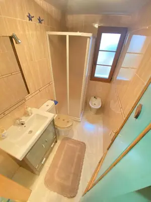 a small bathroom with a sink and a toilet at S&H La Marimorena in Ribadeo