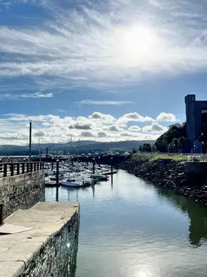 a group of boats docked in a body of water at S&H La Marimorena in Ribadeo