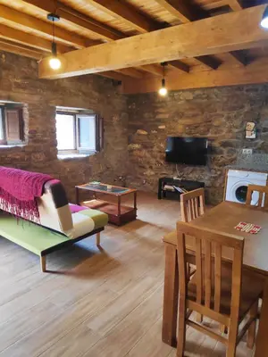 a living room with a couch and a table at Apartamentos C'Ambrosio in La Peral