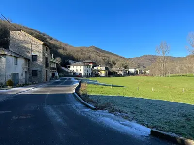 an empty road in a small village with houses at Casa rural LA TORRE recién rehabilitada. in Las Herrerías