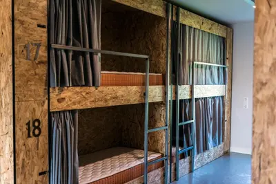 a room with bunk beds in a house at Albergue Santiago 15 Monforte in Monforte de Lemos