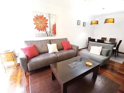 a living room with a couch and a coffee table at Viveiro Histórico in Viveiro