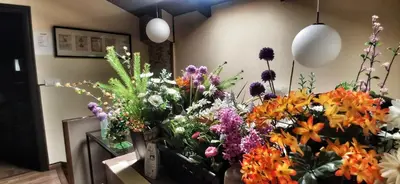a bunch of flowers in vases in a room at Casa Das Airas in Sarria