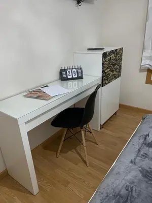 a white desk with a chair in a room at A&M Burela Costa in Burela de Cabo