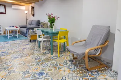 a living room with a table and chairs and a couch at Casa Doade, en A Ribeira Sacra in Doade