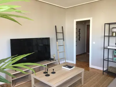 a living room with a tv and a coffee table at ***NUEVO Piso en Ourense WIFI Parking*** in Ourense