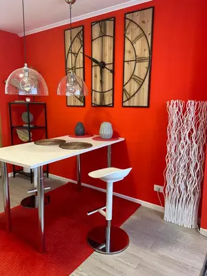 a dining room with red walls and a table and chairs at Apartamento Centro Frente Muralla 2 in Lugo