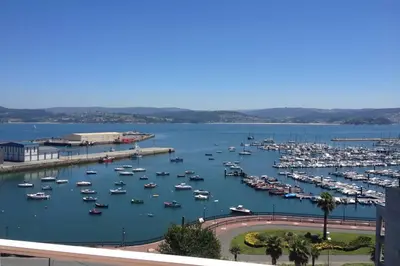 a harbor filled with lots of boats in the water at Attic loft to wake up by the sea. in Sada