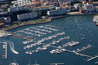 an aerial view of a marina with boats docked at Attic loft to wake up by the sea. in Sada