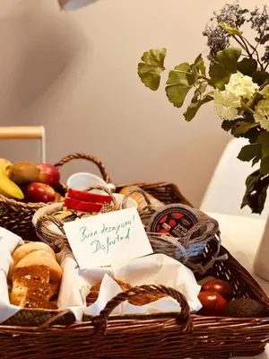a basket of food with a sign that says you deserve approval at Aldea A Paínza in Arzúa