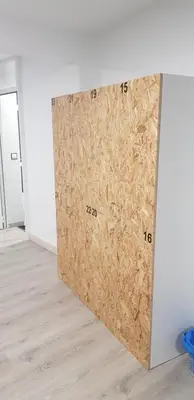 a room with a wall covered in cardboard at Albergue Santos in Santiago de Compostela
