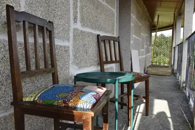 two chairs and a table on a porch at Ribeira Sacra II - Ourense in Nogueira de Ramuin