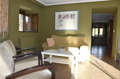 a living room with a couch and a table at Ribeira Sacra II - Ourense in Nogueira de Ramuin