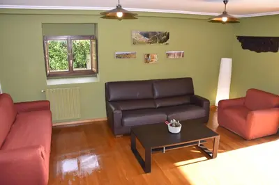 a living room with two couches and a coffee table at Ribeira Sacra II - Ourense in Nogueira de Ramuin