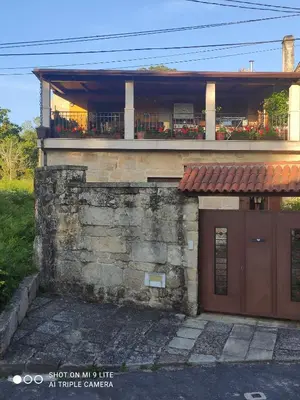 a house with a garage and a balcony at CASA BOREAL in Ourense
