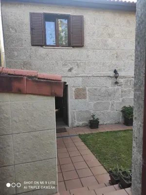 a building with a window on the side of it at CASA BOREAL in Ourense