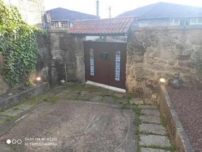 an entrance to a building with a red door at CASA BOREAL in Ourense