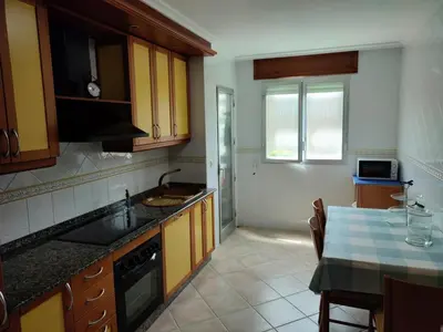 a kitchen with a sink and a counter top at ACT RIOCOBO in Cervo