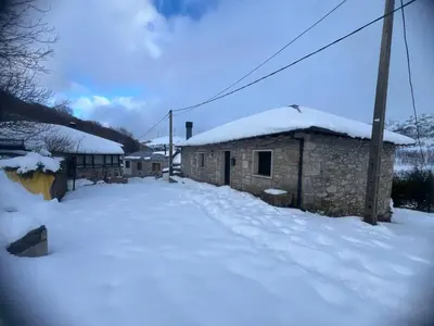 a building with snow on the side of it at Villa Adilia in Padornelo
